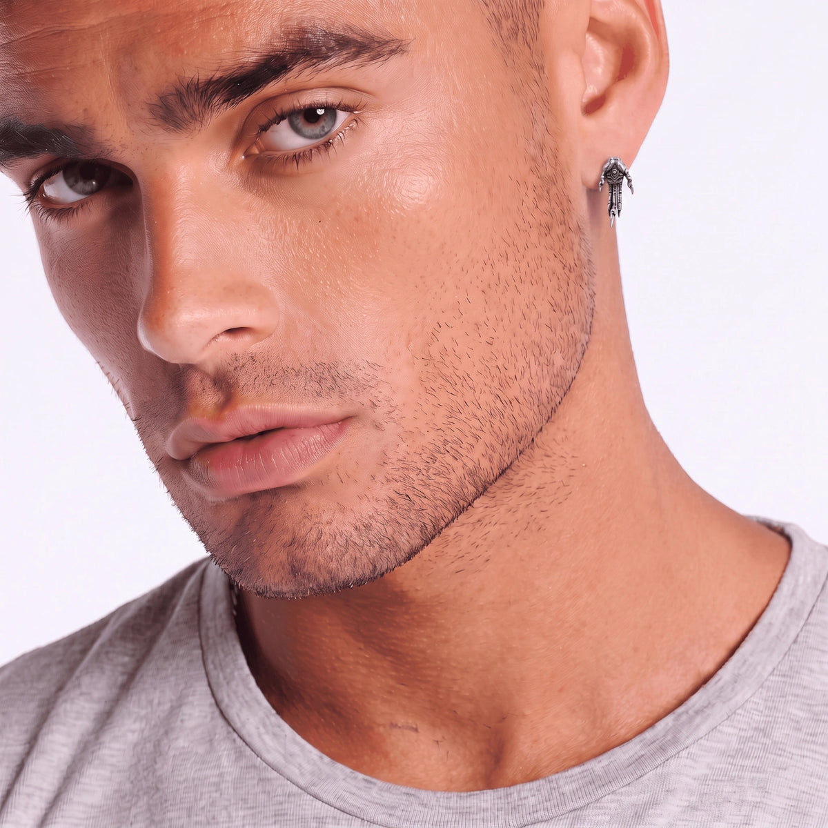 Model wearing the Third Eye Claw single stud earring as an asymmetric dark-celestial look