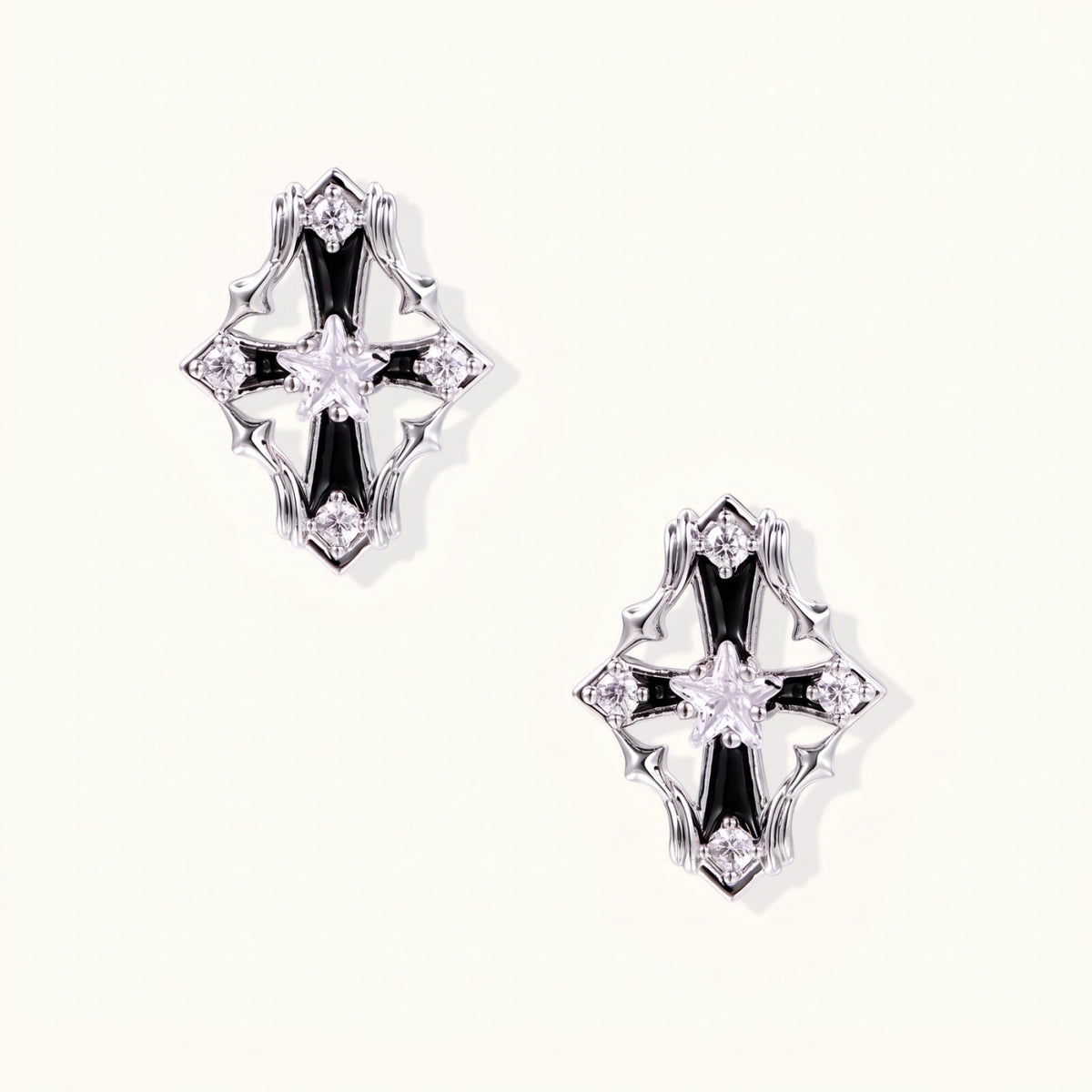 Celestial Cross Noir stud earrings with black enamel, white gold plated frame and star-cut zirconia