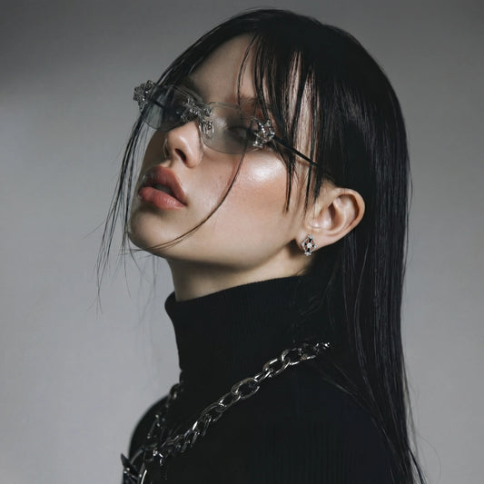 Model wearing Celestial Cross Noir stud earrings with black enamel and zirconia accents