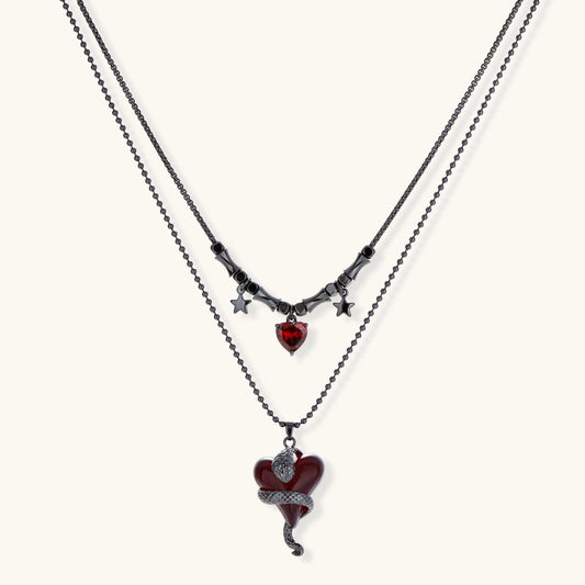 Crimson Serpent Hearts layered necklace with red resin heart, serpent detail, zirconia heart and star accents