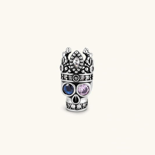 Angled view of Crowned Skull single stud earring showing the crown and multicolored cubic zirconia details