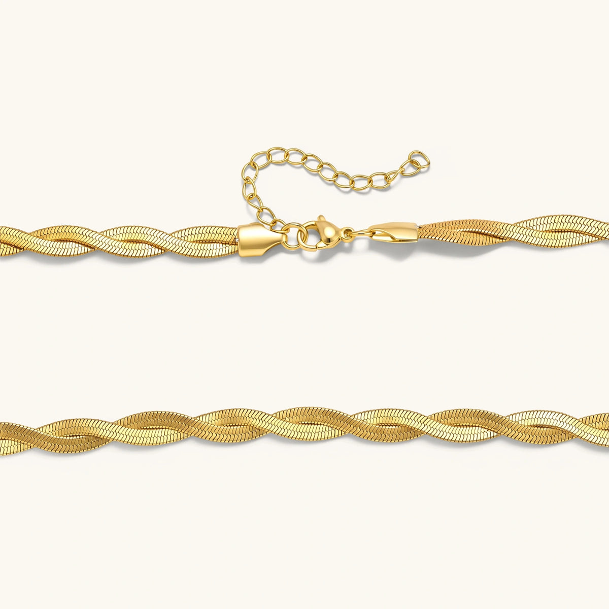Close detail of Golden Orbit twisted herringbone chain showing the interwoven gold-plated links