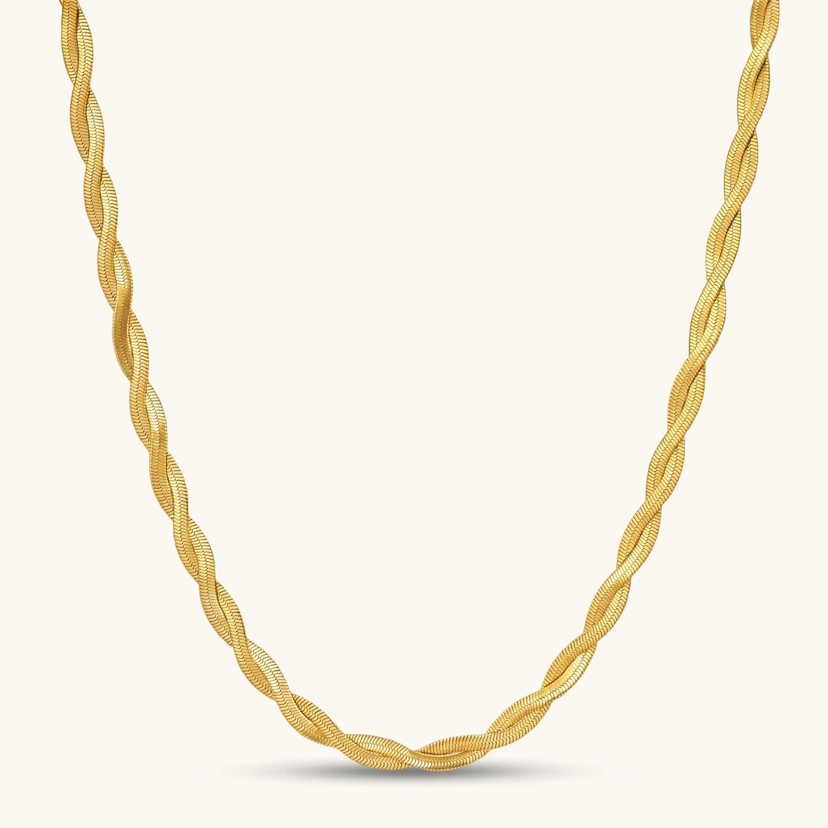 Golden Orbit twisted herringbone chain in 18K gold-plated stainless steel with sculptural braided texture