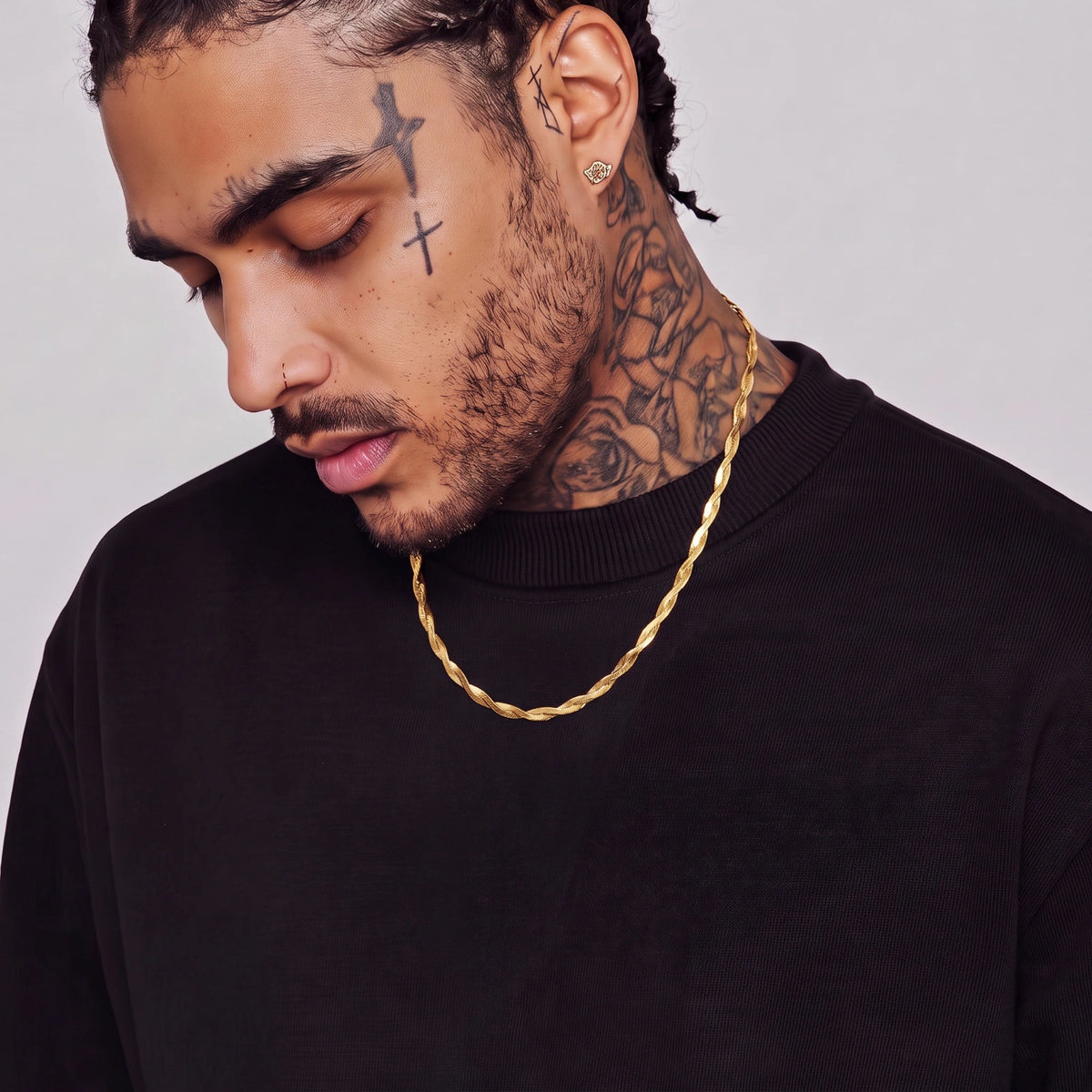 Golden Orbit twisted herringbone chain styled on a model for a polished men’s jewelry look
