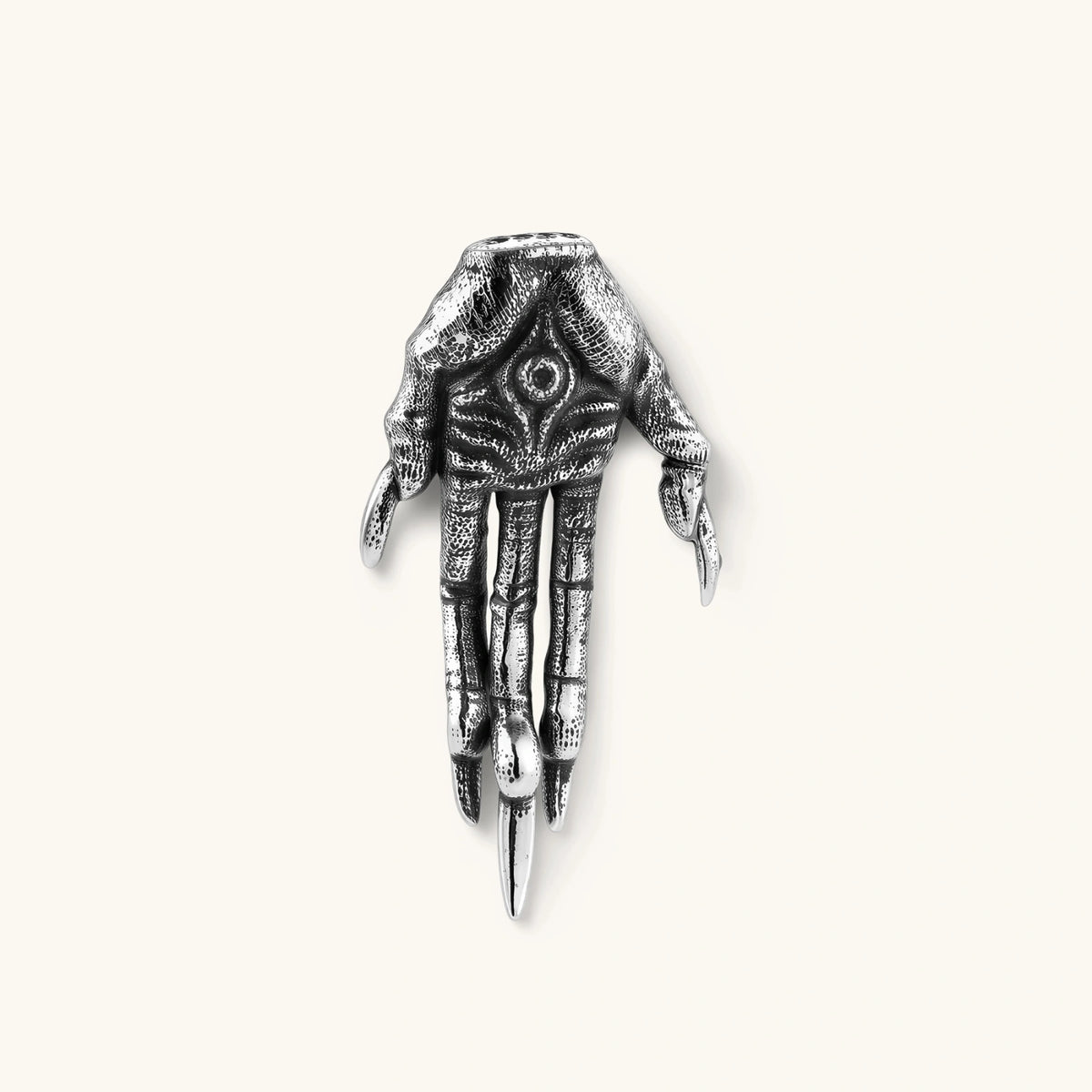 Angled view of Third Eye Claw single stud earring showing the hand and eye details