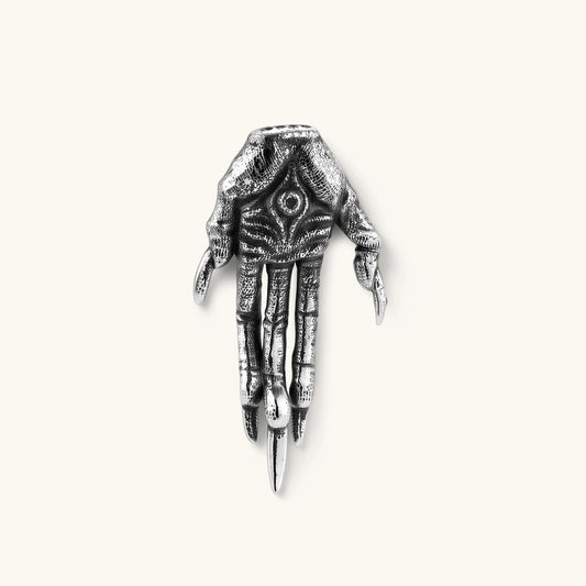 Angled view of Third Eye Claw single stud earring showing the hand and eye details
